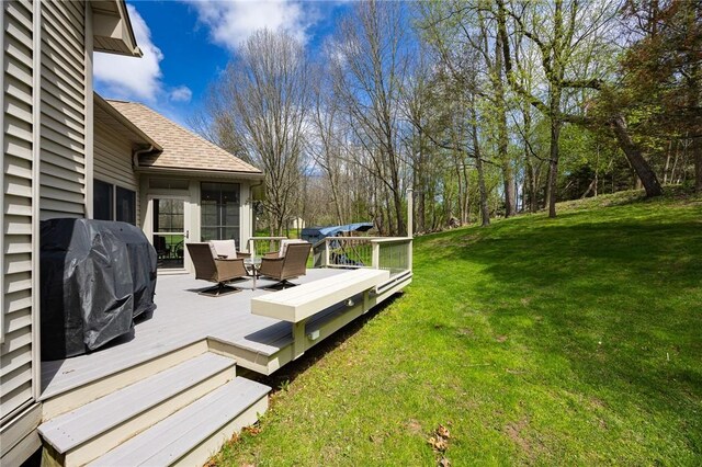 view of yard with a wooden deck