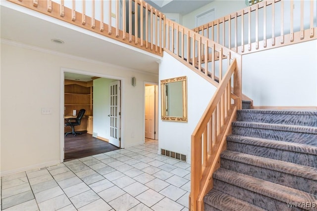 7 Contessa Ct, Amherst, NY 14221 - stairs with visible vents, ornamental molding, french doors, and tile patterned flooring