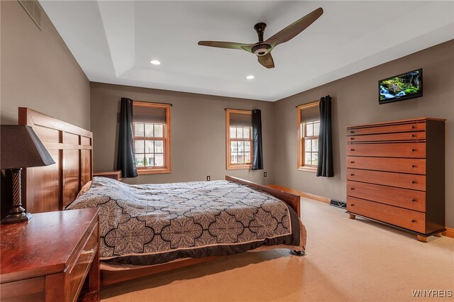 carpeted bedroom with baseboards, multiple windows, recessed lighting, and visible vents