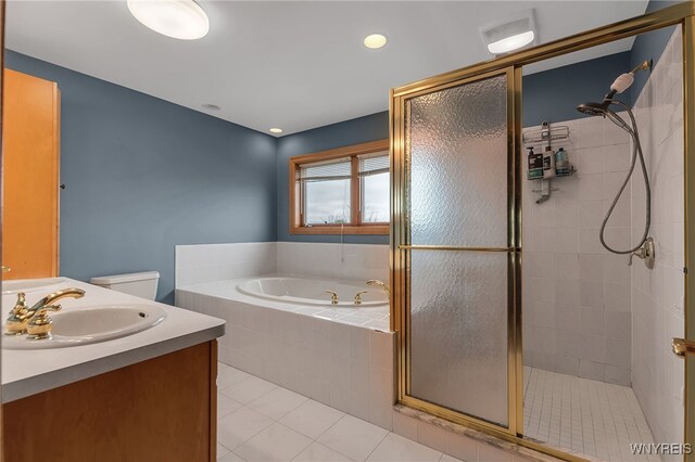 bathroom featuring vanity, tile patterned floors, a garden tub, and a stall shower