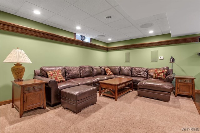 living room featuring recessed lighting, baseboards, and light carpet