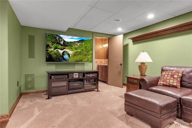 living room featuring recessed lighting, baseboards, and light colored carpet