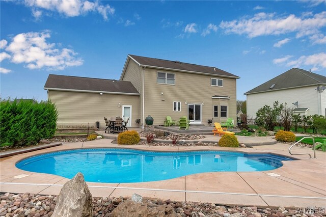 outdoor pool with a patio area