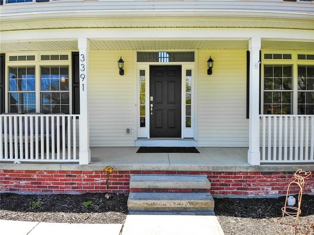 property entrance featuring covered porch
