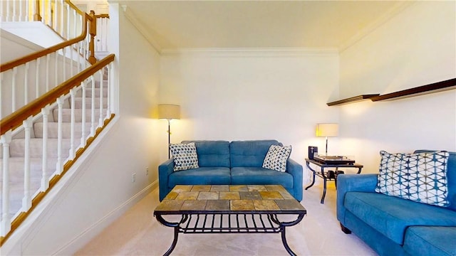 carpeted living room with stairway, baseboards, and ornamental molding