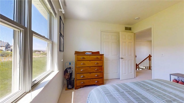 bedroom with carpet floors and visible vents