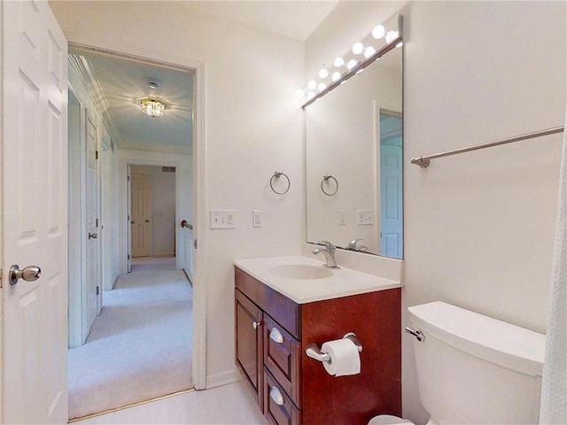 bathroom with toilet and vanity