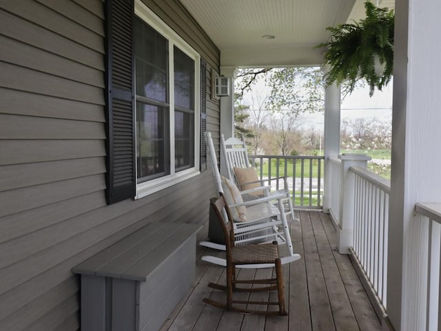 wooden terrace with a porch