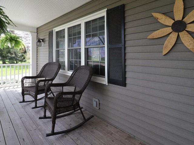 deck with covered porch and ceiling fan