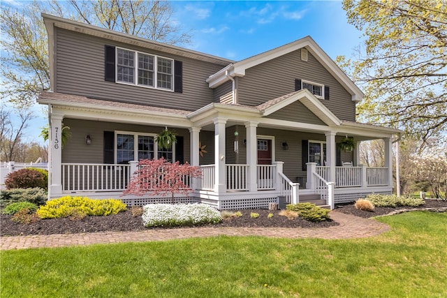 view of front of house with a front lawn and covered porch
