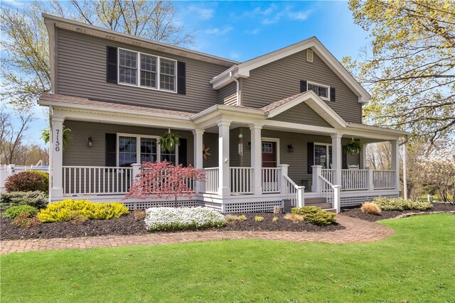 view of front of house with a front lawn and covered porch