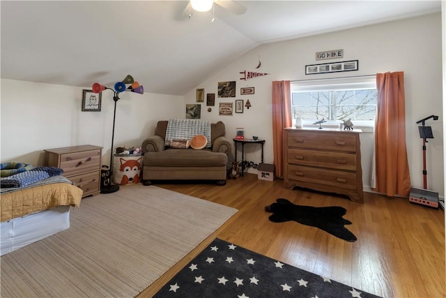bedroom featuring lofted ceiling, wood finished floors, and ceiling fan