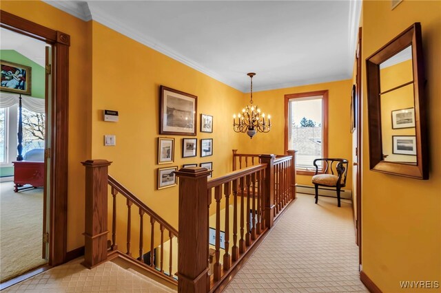 hall featuring carpet flooring, an inviting chandelier, baseboards, an upstairs landing, and a baseboard heating unit