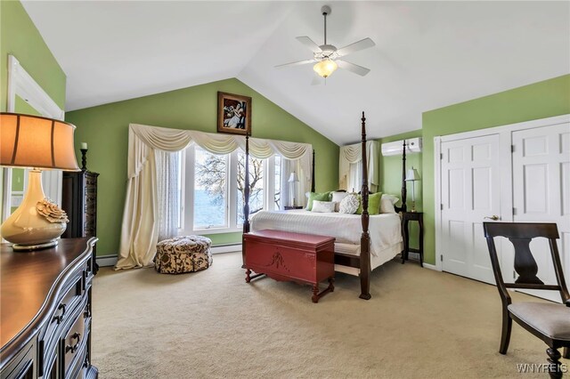 bedroom with light carpet, baseboards, ceiling fan, a baseboard radiator, and vaulted ceiling