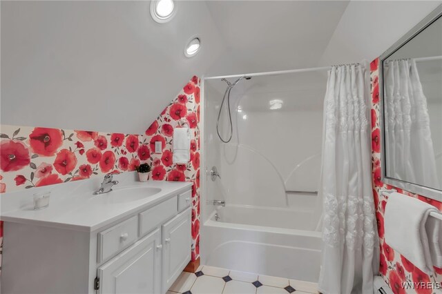full bathroom featuring vanity, shower / bath combo with shower curtain, recessed lighting, and lofted ceiling