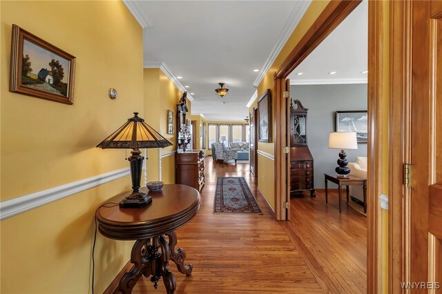 hallway with crown molding, recessed lighting, and wood finished floors