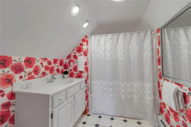 full bath featuring a shower with curtain, a baseboard heating unit, lofted ceiling, and vanity
