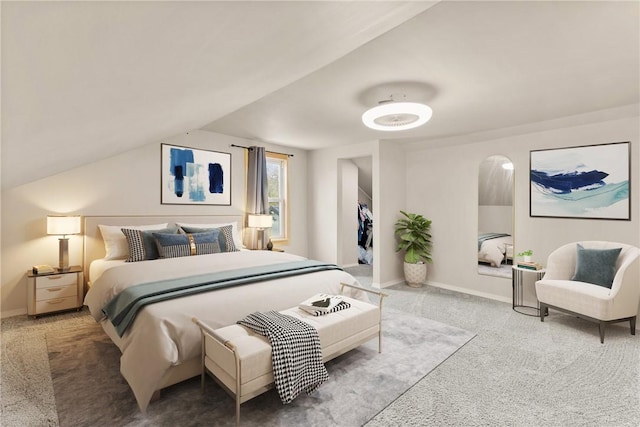 carpeted bedroom with baseboards and arched walkways