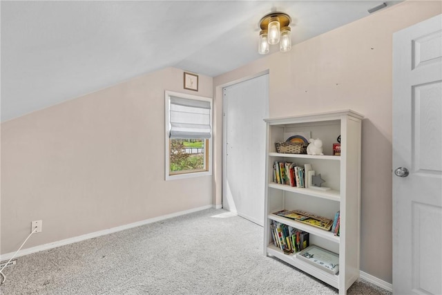playroom featuring carpet flooring, baseboards, and lofted ceiling