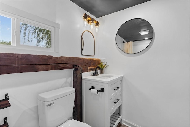 bathroom with toilet and vanity