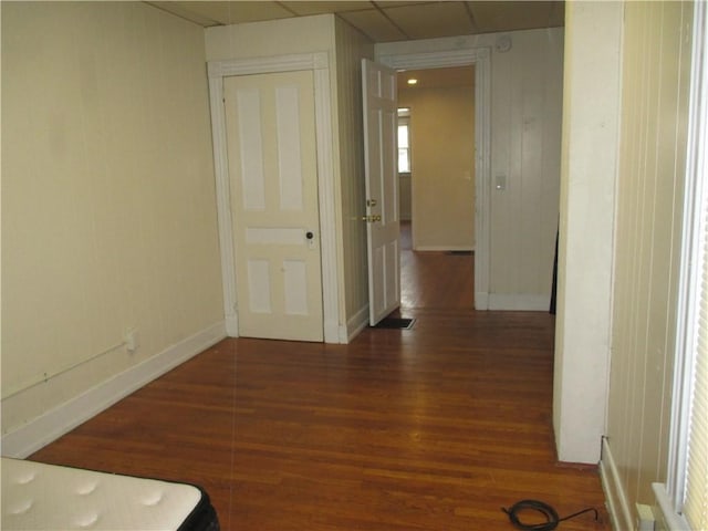 57-59 Maple St, Oneonta-City, NY 13820 - hallway with baseboards, wood finished floors, and a paneled ceiling