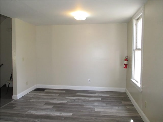 57-59 Maple St, Oneonta-City, NY 13820 - unfurnished room with baseboards and wood finished floors