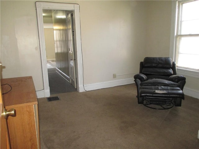57-59 Maple St, Oneonta-City, NY 13820 - living area with carpet floors, baseboards, and visible vents