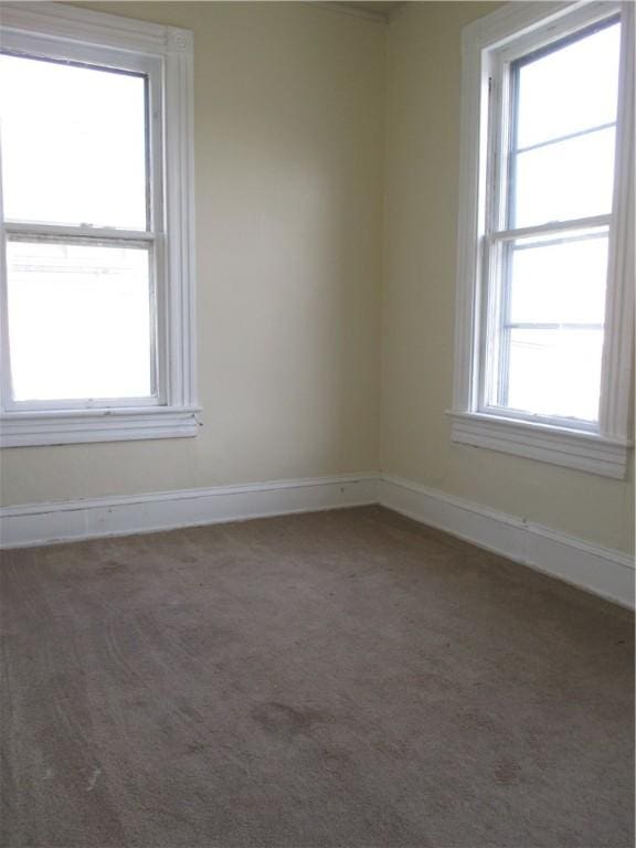 57-59 Maple St, Oneonta-City, NY 13820 - carpeted empty room with baseboards