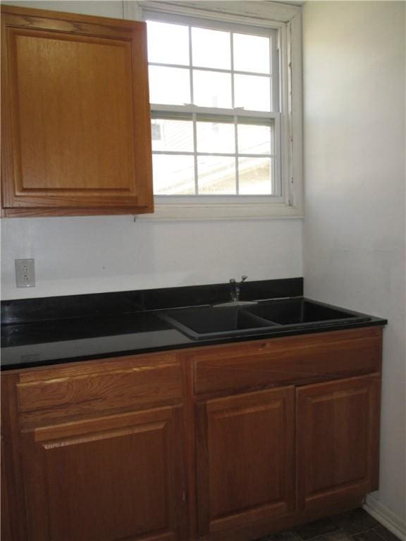 57-59 Maple St, Oneonta-City, NY 13820 - kitchen with a sink, brown cabinets, and dark countertops