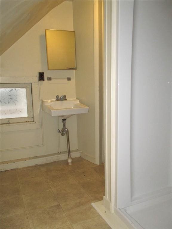 57-59 Maple St, Oneonta-City, NY 13820 - bathroom featuring a sink and lofted ceiling