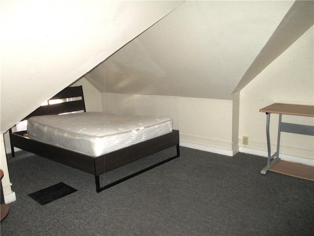 57-59 Maple St, Oneonta-City, NY 13820 - bedroom with baseboards, dark carpet, and lofted ceiling