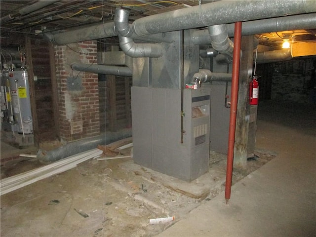 57-59 Maple St, Oneonta-City, NY 13820 - unfinished basement featuring water heater and heating unit