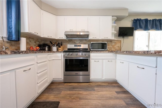 kitchen featuring appliances with stainless steel finishes, tasteful backsplash, open shelves, and under cabinet range hood