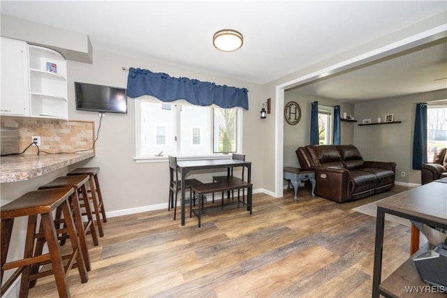 5048 Armor Duells Rd, Orchard Park, NY 14127 - living room featuring baseboards and light wood finished floors