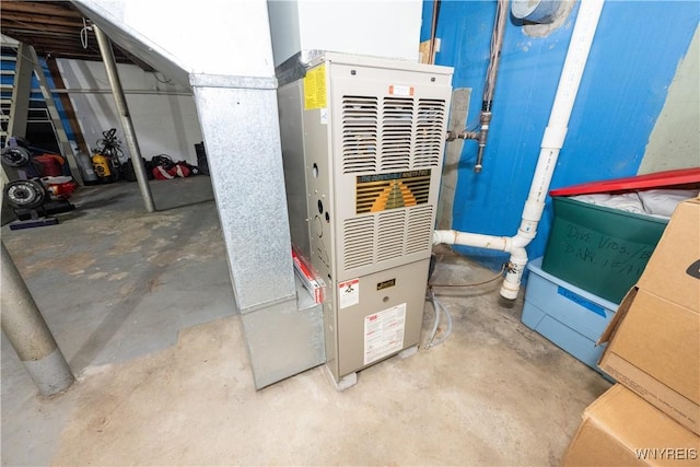 utility room with heating unit
