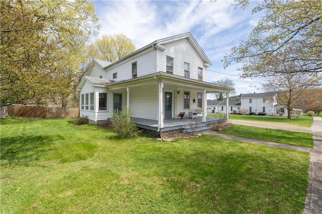 9 Porter St, Prattsburgh, NY 14873 - view of side of property with a yard, fence, and covered porch