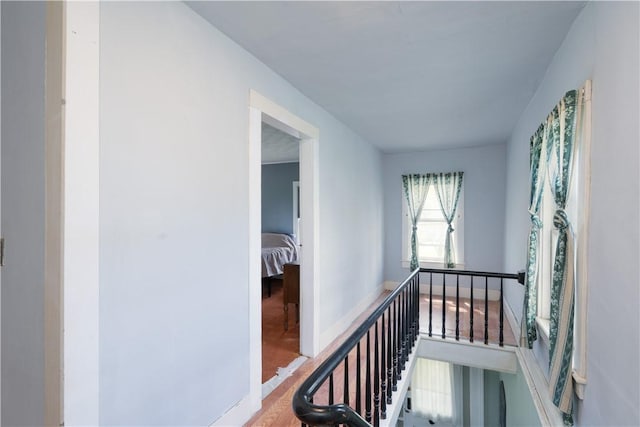 9 Porter St, Prattsburgh, NY 14873 - corridor with baseboards, an upstairs landing, and wood finished floors
