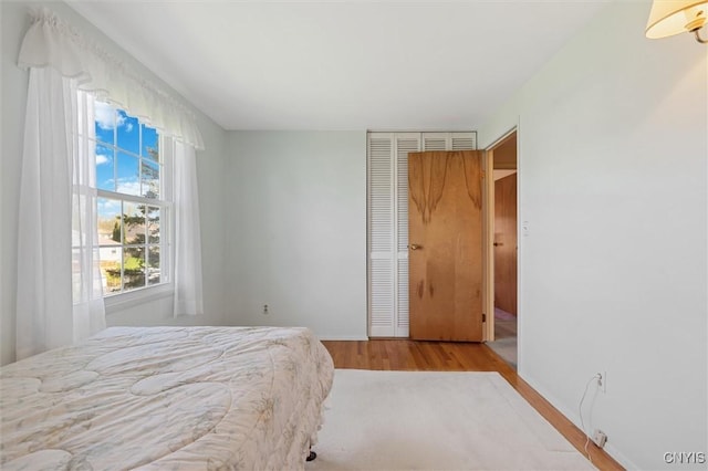4765 Rosemary Ln, Clay, NY 13088 - bedroom featuring baseboards and wood finished floors