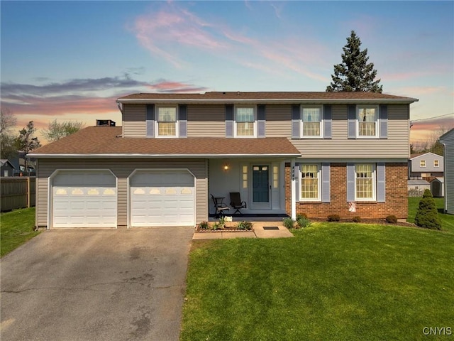 4765 Rosemary Ln, Clay, NY 13088 - traditional home featuring a yard, brick siding, driveway, and a garage