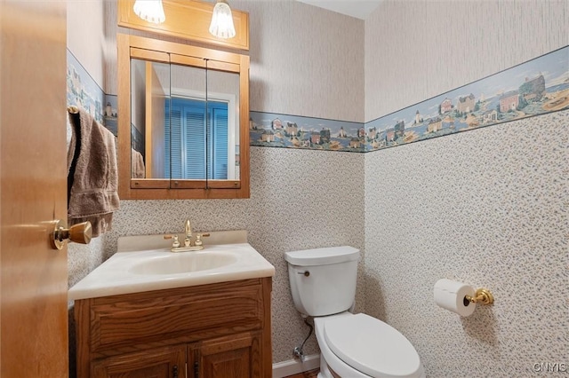 4765 Rosemary Ln, Clay, NY 13088 - bathroom featuring vanity, toilet, and wallpapered walls