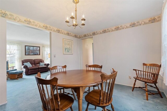 4765 Rosemary Ln, Clay, NY 13088 - dining space with carpet floors, baseboards, and a notable chandelier