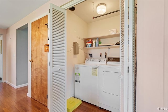 4765 Rosemary Ln, Clay, NY 13088 - clothes washing area with baseboards, laundry area, wood finished floors, and washer and clothes dryer