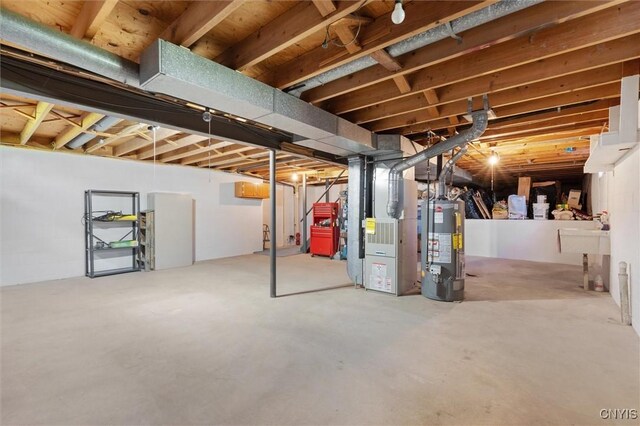 4765 Rosemary Ln, Clay, NY 13088 - unfinished basement featuring heating unit and gas water heater