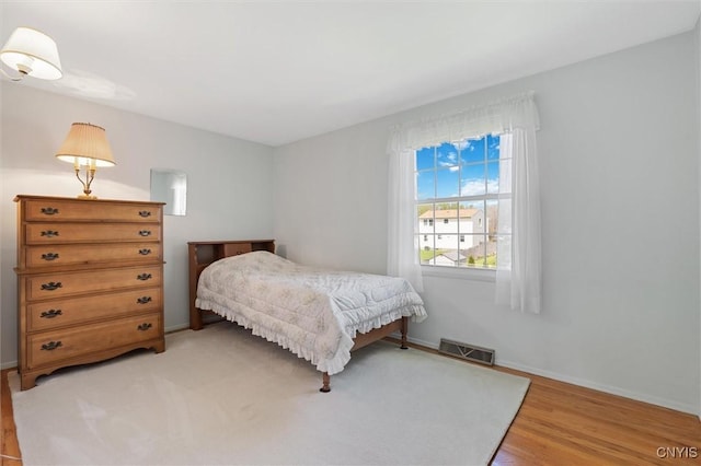 4765 Rosemary Ln, Clay, NY 13088 - bedroom featuring baseboards, visible vents, and light wood-style floors