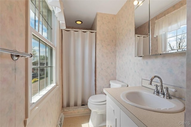 4765 Rosemary Ln, Clay, NY 13088 - full bath featuring vanity, plenty of natural light, wallpapered walls, and toilet