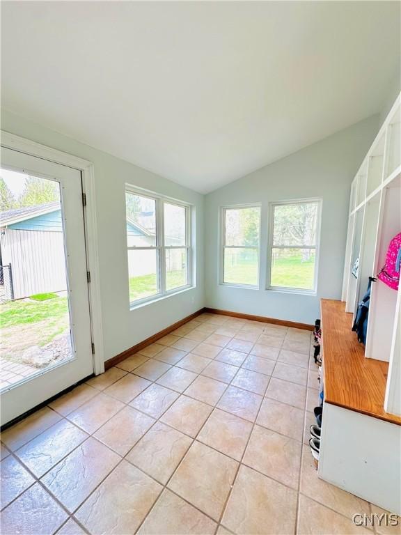 1058 State Route 48, Granby, NY 13069 - interior space with light tile patterned floors, baseboards, and vaulted ceiling