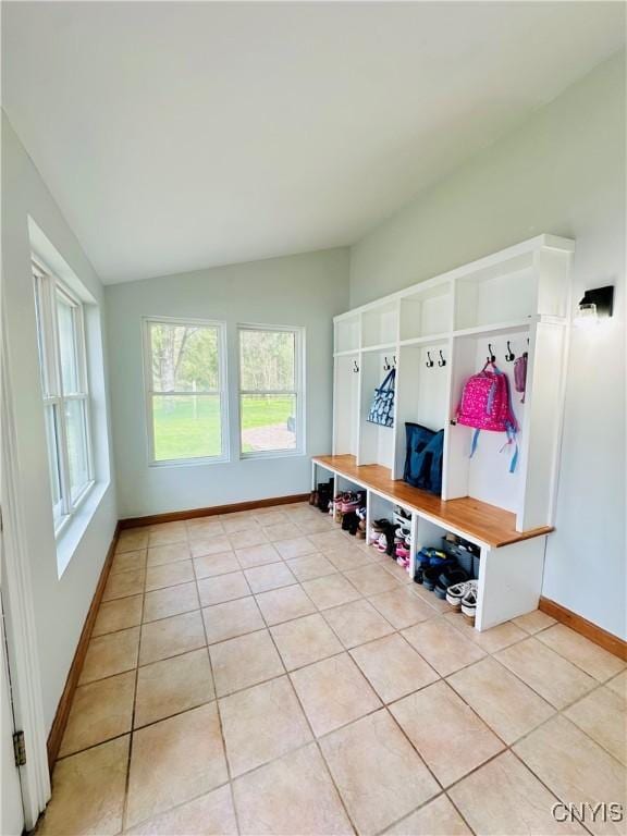 1058 State Route 48, Granby, NY 13069 - mudroom with baseboards, vaulted ceiling, and light tile patterned floors