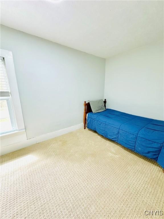1058 State Route 48, Granby, NY 13069 - unfurnished bedroom featuring carpet floors