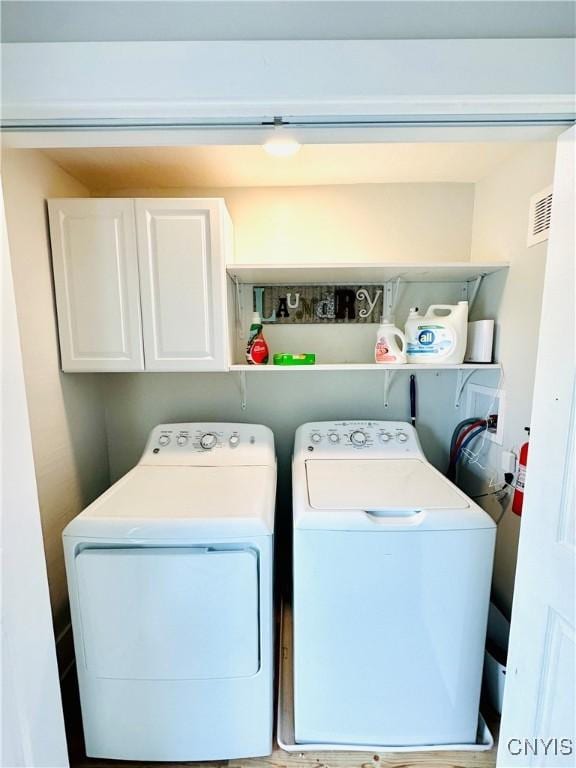 1058 State Route 48, Granby, NY 13069 - clothes washing area featuring separate washer and dryer, cabinet space, and visible vents