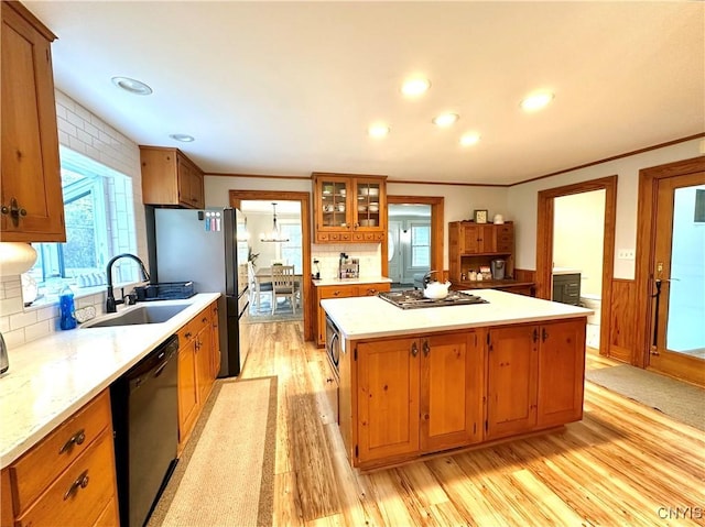 1058 State Route 48, Granby, NY 13069 - kitchen with a sink, light wood finished floors, a center island, stainless steel appliances, and decorative backsplash